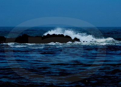 Waves crashing at dusk